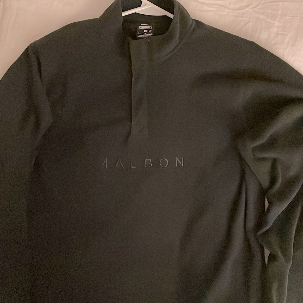 NIKE AND MALBON COLLABORATION: 1/4 ZIP SWEATER.